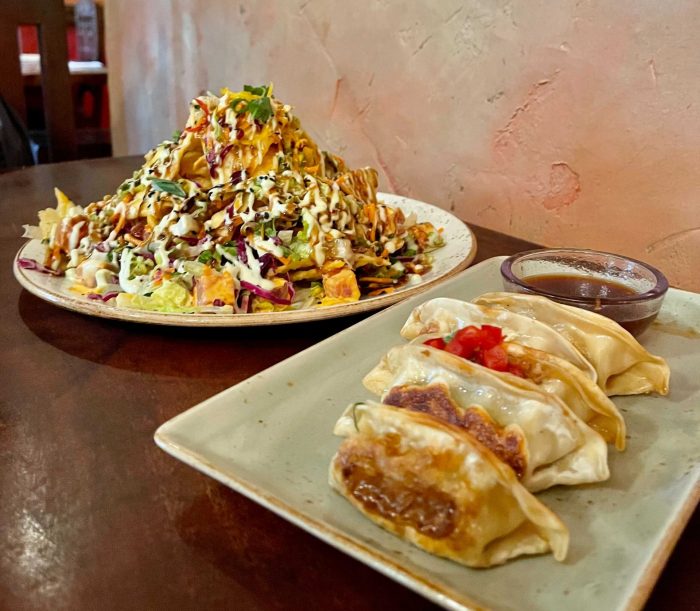 https://touringplans.com/blog/wp-content/uploads/2021/04/Ahi-Nachos-and-Pot-Stickers-Yak-and-Yeti-scaled-e1617591111115-700x611.jpg