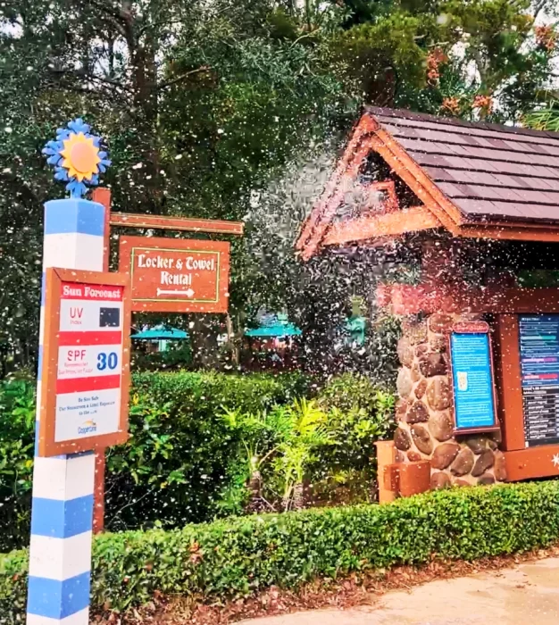 Simulated snowflakes (made of small soap bubbles) falls fown on an alpine cottage at Disney's Blizzard Beach water park.