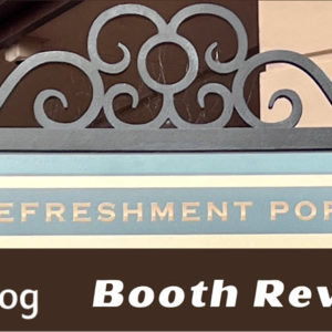 Refreshment Port Festival of Holidays Booth Review showing the top of menu sign with filigree metalwork