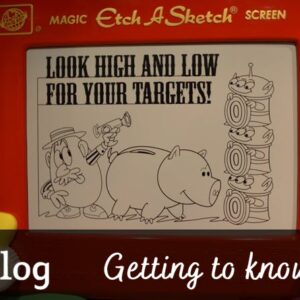 Toy Story Mania cover image showing the giant Etch-A-Sketch from the ride's queue with advice about how to score points.