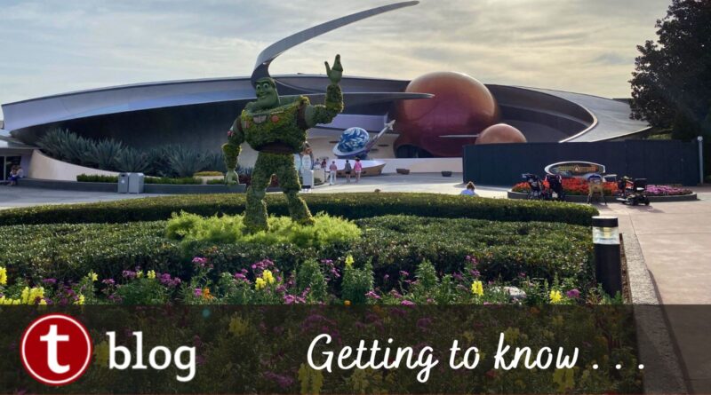 Five Things to Know Mission Space Cover Image showing Buzz Lightyear Topiary in front of the planets of the Mission Space building.